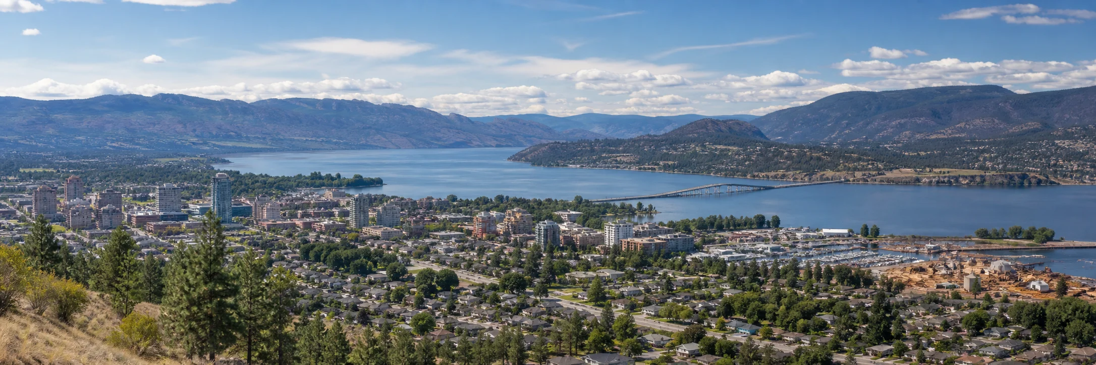 Downtown Kelowna, Okanagan Lake and the William R. Bennett Bridge representing the BC clinics